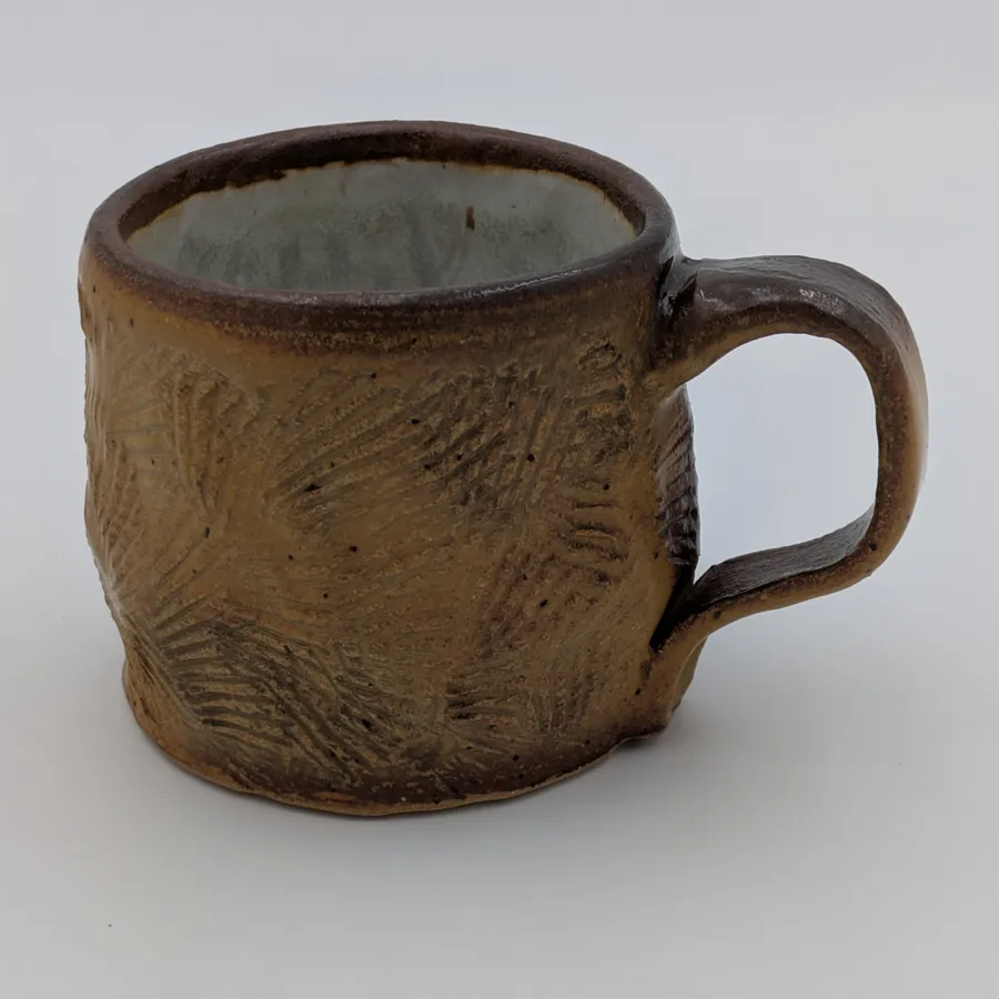 Handbuilt mug with shell texture